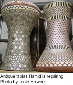 Antique tablas Hamid will repair. Photo by Louie Holwerk.